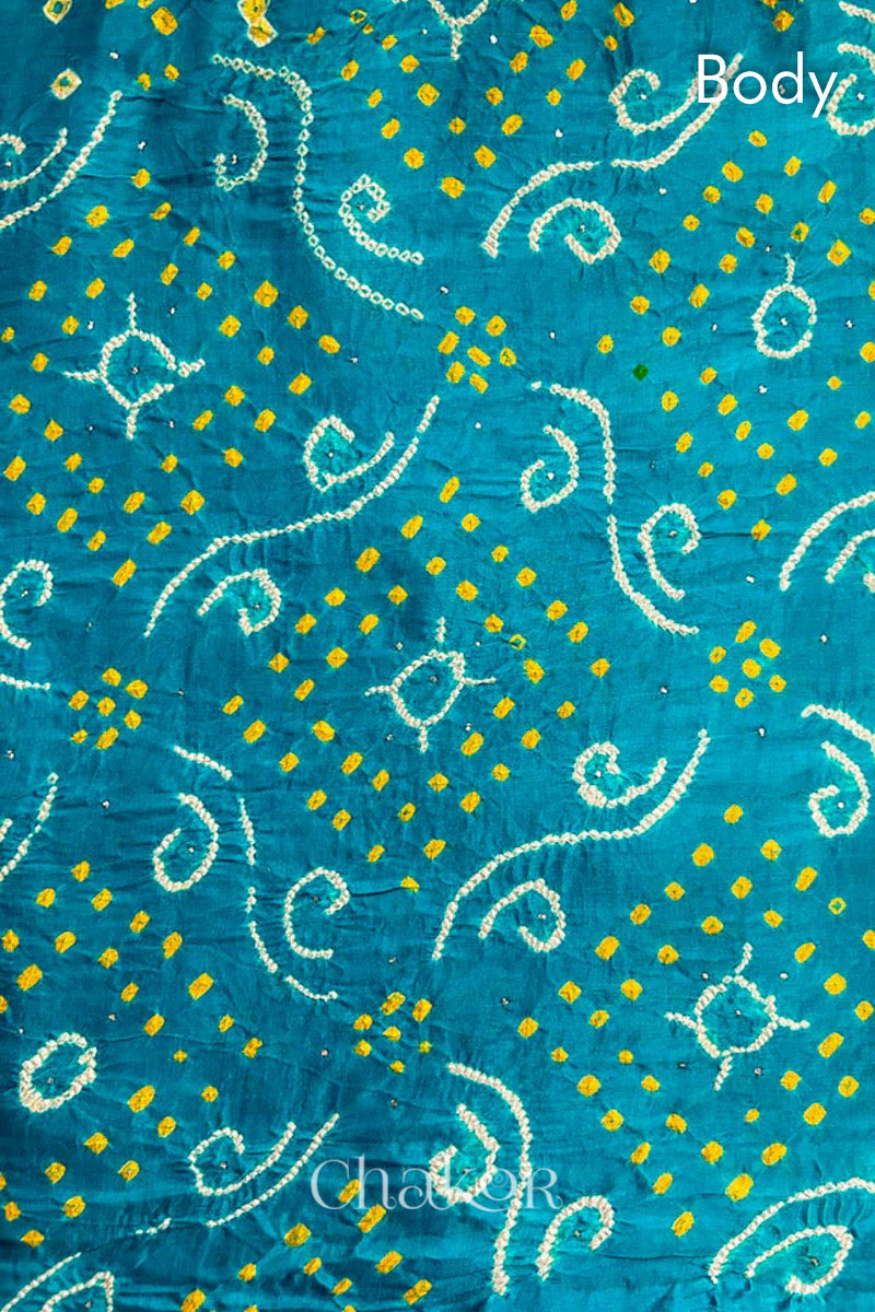 Body design detail of Peacock Blue Bandhani Gaji Silk Saree, handcrafted with rai bandhej patterns and mukaish embroidery.