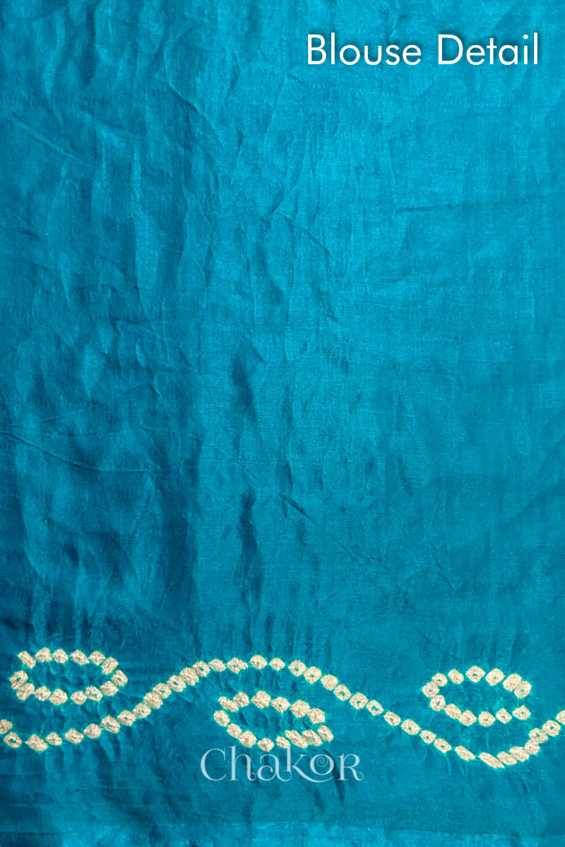 Blouse detail of Peacock Blue Bandhani Gaji Silk Saree, handcrafted with rai bandhej patterns and mukaish embroidery.