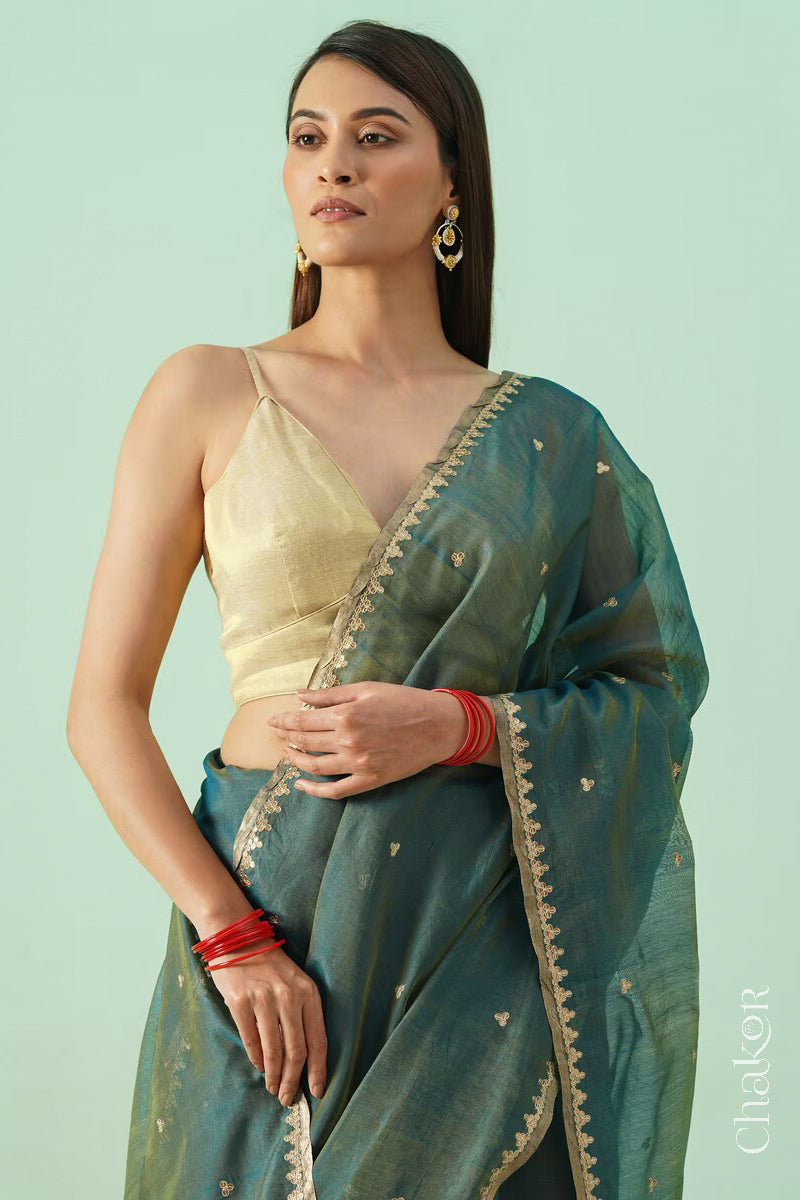 Model in Teal Blue Chanderi  silk cotton saree showing embroidered border and woven texture.
