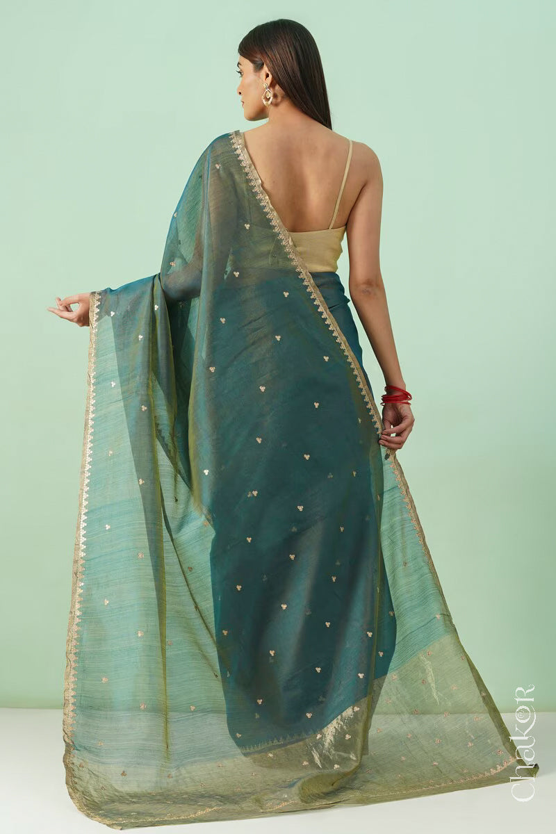 Back view of Teal Blue Chanderi  silk cotton saree showing the  sheen and embroidered details.
