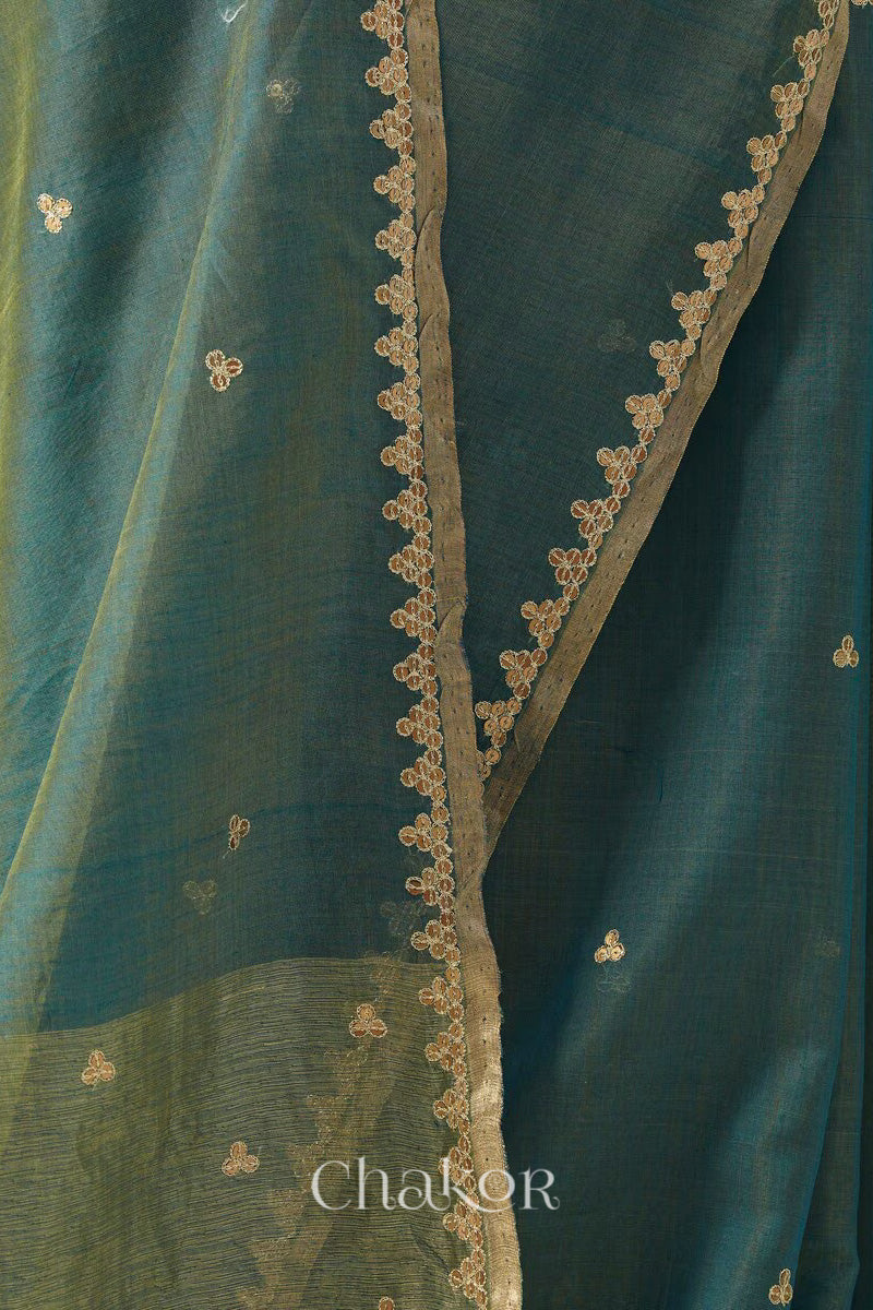 Close-up of embroidered sequin tikki border and zari details on Teal Blue Chanderi  silk cotton saree.
