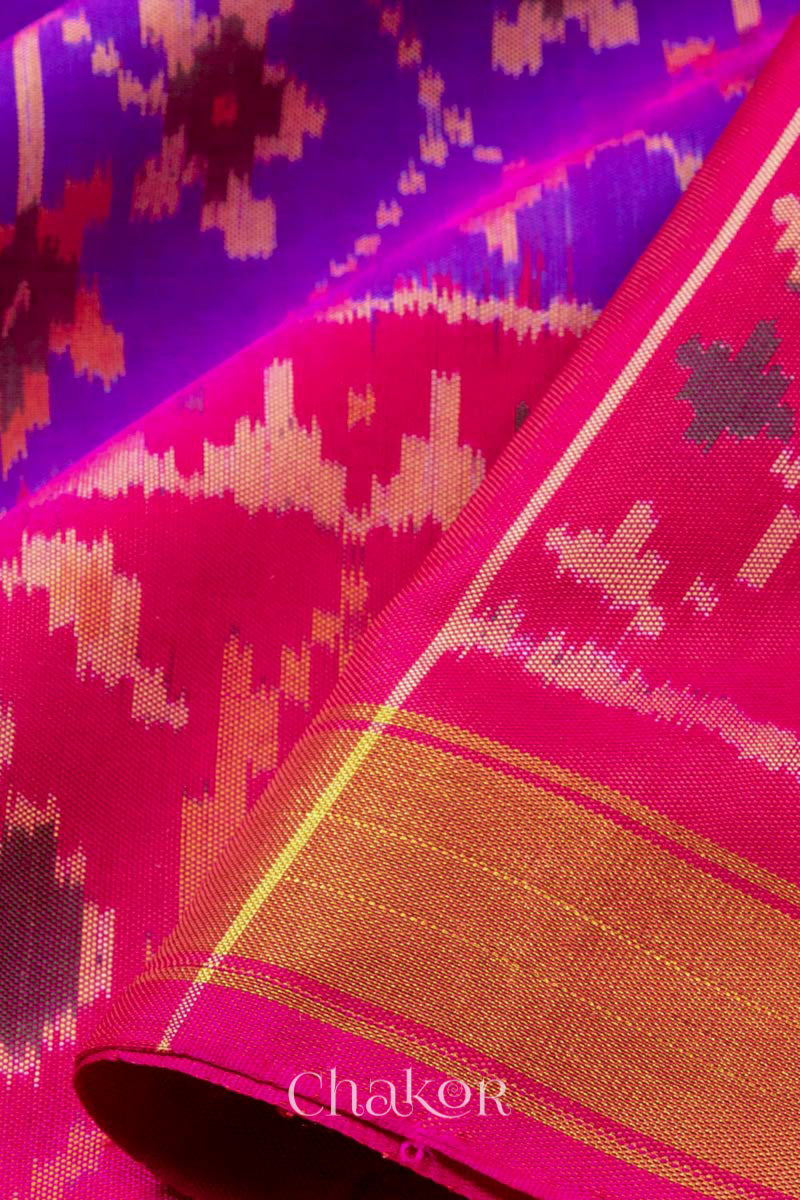 Close up details of Handloom Purple Pink Ikat Patola Mulberry Silk Saree with traditional design.