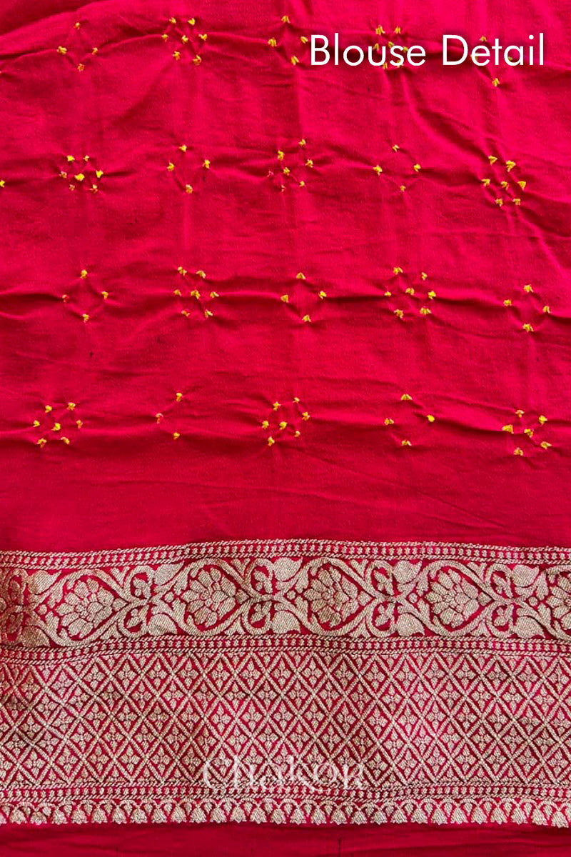 Close up of  Handcrafted Red Bandhani Banarasi Georgette Saree in pure silk featuring zari weaving and Kutch Bandhej with mirror embroidery, Perfect for wedding and occasions.