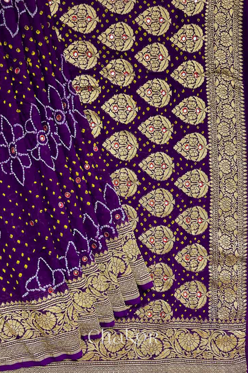 Close up of Handcrafted Purple Bandhani Banarasi Georgette Silk Saree featuring zari weaving and Kutch Bandhej with mirror embroidery.