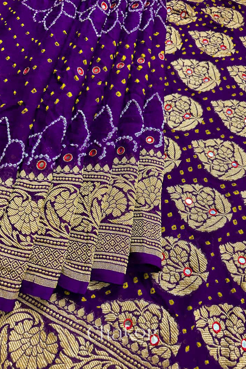 Close up of Handcrafted Purple Bandhani Banarasi Georgette Silk Saree featuring zari weaving and Kutch Bandhej with mirror embroidery.