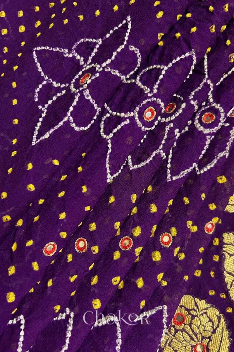 Close up of Handcrafted Purple Bandhani Banarasi Georgette Pure Silk Saree featuring zari weaving and Kutch Bandhej with mirror embroidery.