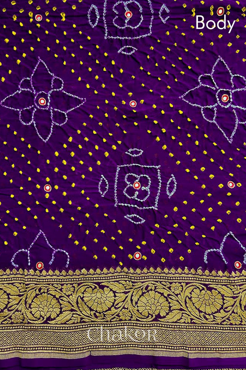 Close up of Handcrafted Purple Bandhani Banarasi Georgette Pure Silk Saree featuring zari weaving and Kutch Bandhej with mirror embroidery.
