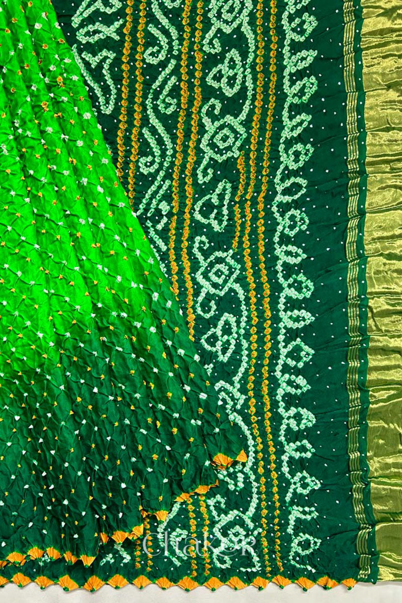 Handcrafted Parrot and green ombre Bandhani Gaji Silk Saree with traditional bandhej patterns and mukaish embroidery.