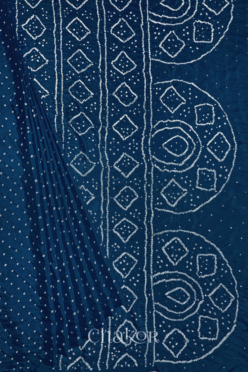 Pleated view of indigo blue Bandhani Mulberry Silk Saree, handcrafted in rai bandhej patterns with mukaish embroidery.