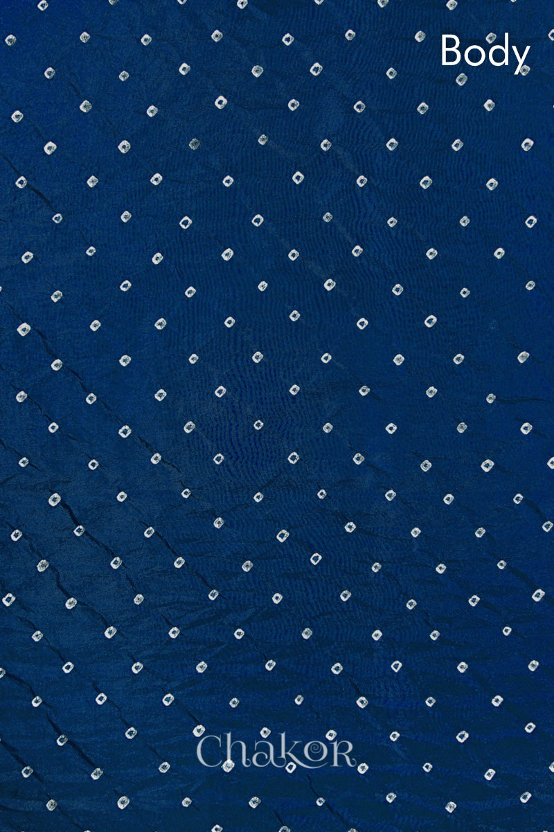 Body pattern detail of indigo blue Bandhani Mulberry Silk Saree, handcrafted in rai bandhej patterns with mukaish embroidery.