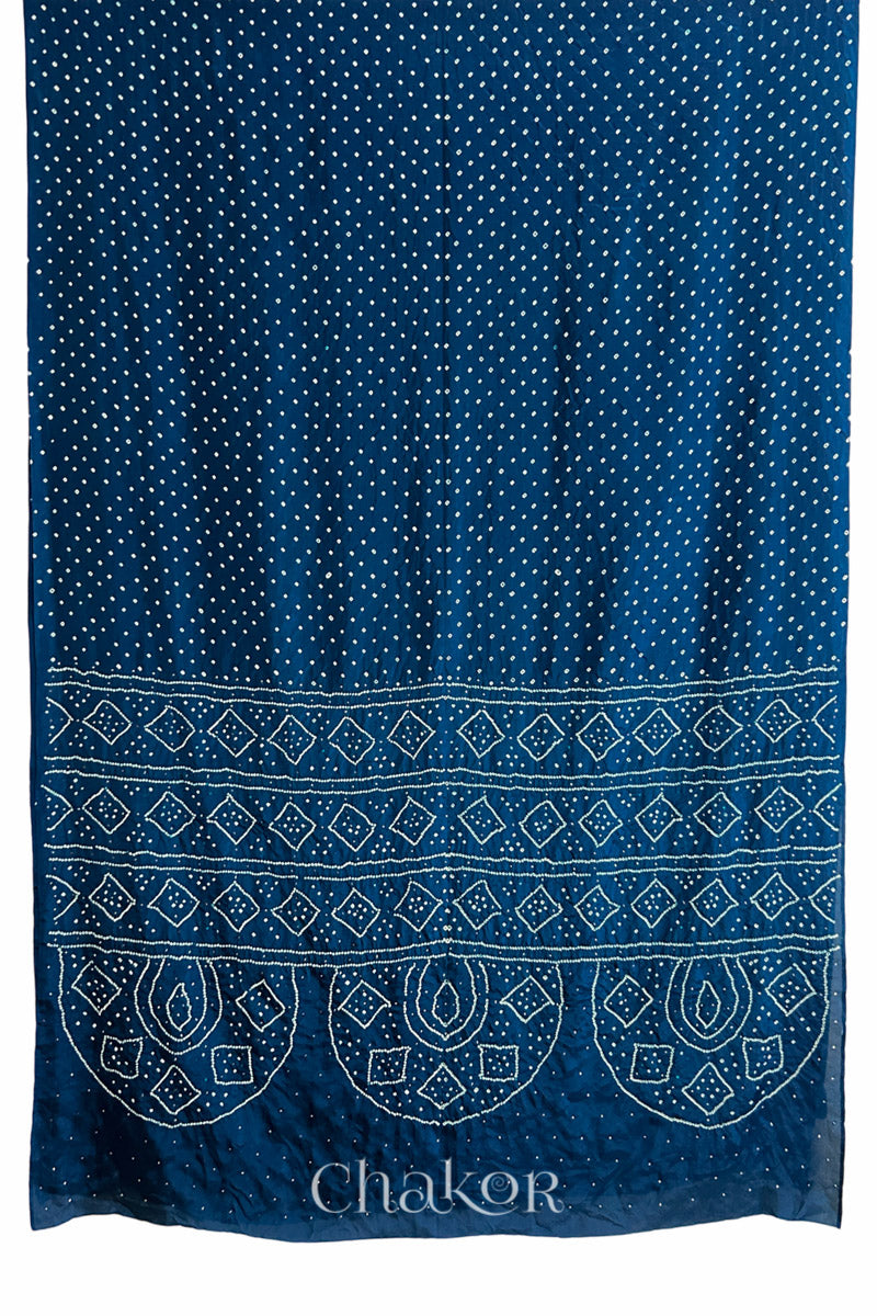 Full view of indigo blue Bandhani Mulberry Silk Saree, handcrafted in rai bandhej patterns with mukaish embroidery.