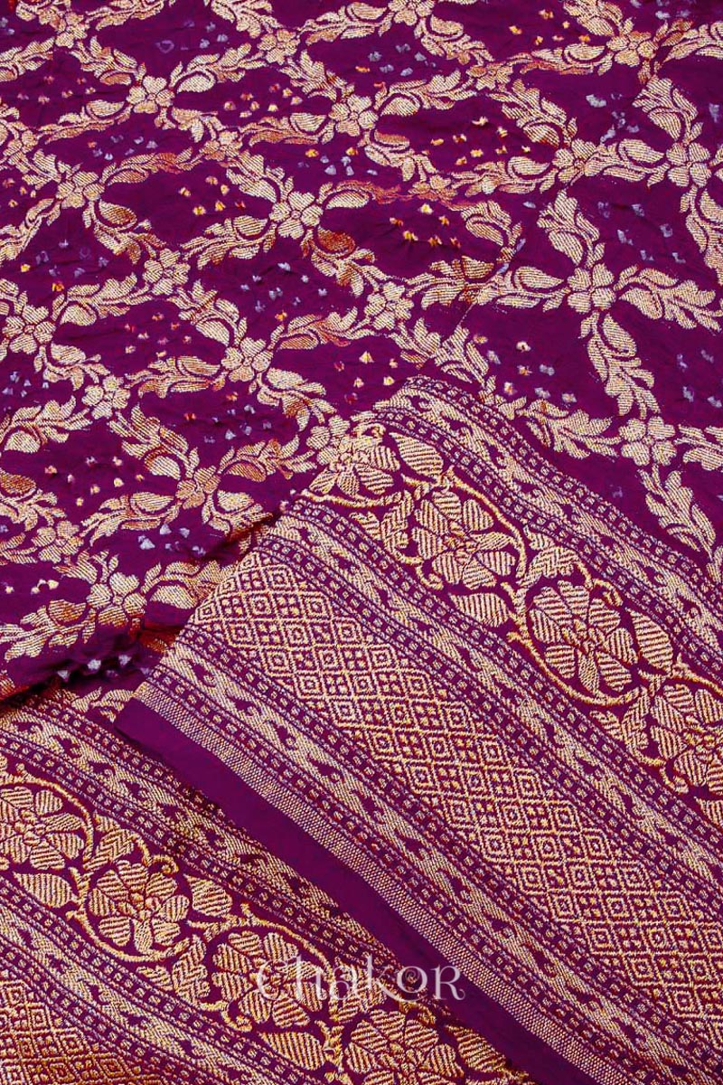 Close up of Handcrafted Purple Bandhani Banarasi Georgette Saree in pure silk featuring zari weaving and Kutch Bandhej for weddings and occasions.