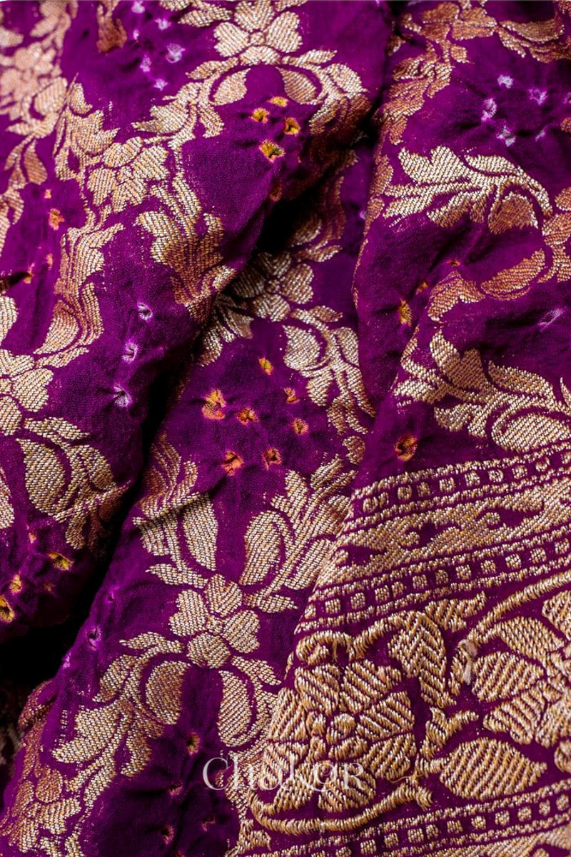 Close up of Handcrafted Purple Bandhani Banarasi Georgette Saree in pure silk featuring zari weaving and Kutch Bandhej for weddings and occasions.