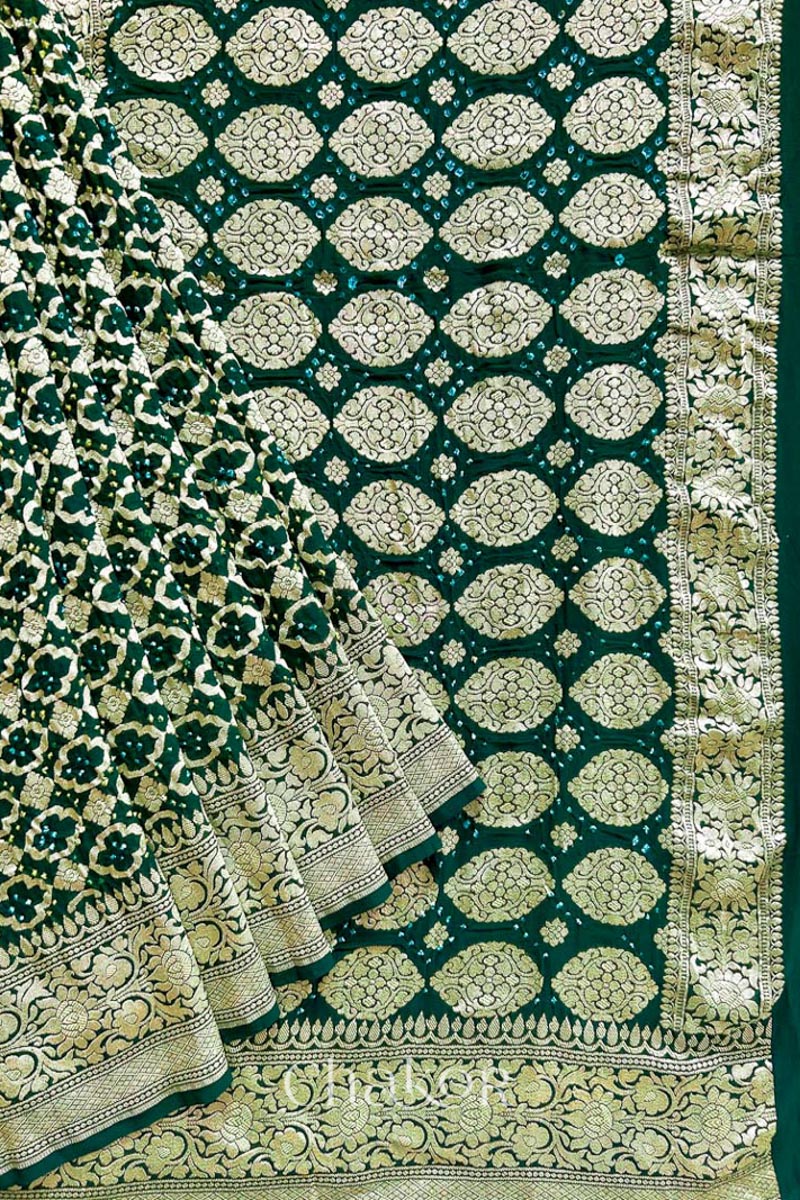 Close up of Handcrafted Green Bandhani Banarasi Georgette Saree in pure silk featuring zari weaving and Kutch Bandhej for weddings and occasions.
