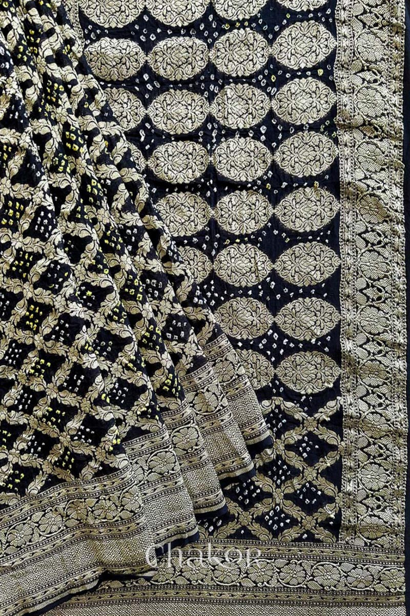 Close up of Handcrafted Black Bandhani Banarasi Georgette Saree in pure silk featuring zari weaving and Kutch Bandhej for weddings and occasions.