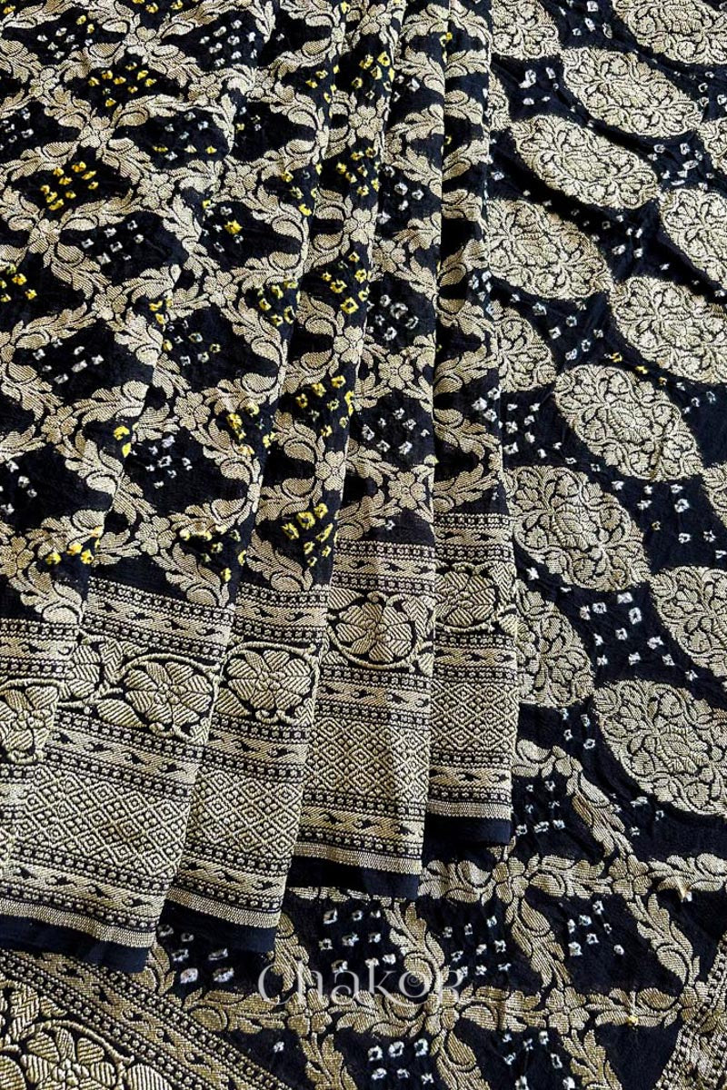 Close up of Handcrafted Black Bandhani Banarasi Georgette Saree in pure silk featuring zari weaving and Kutch Bandhej for weddings and occasions.