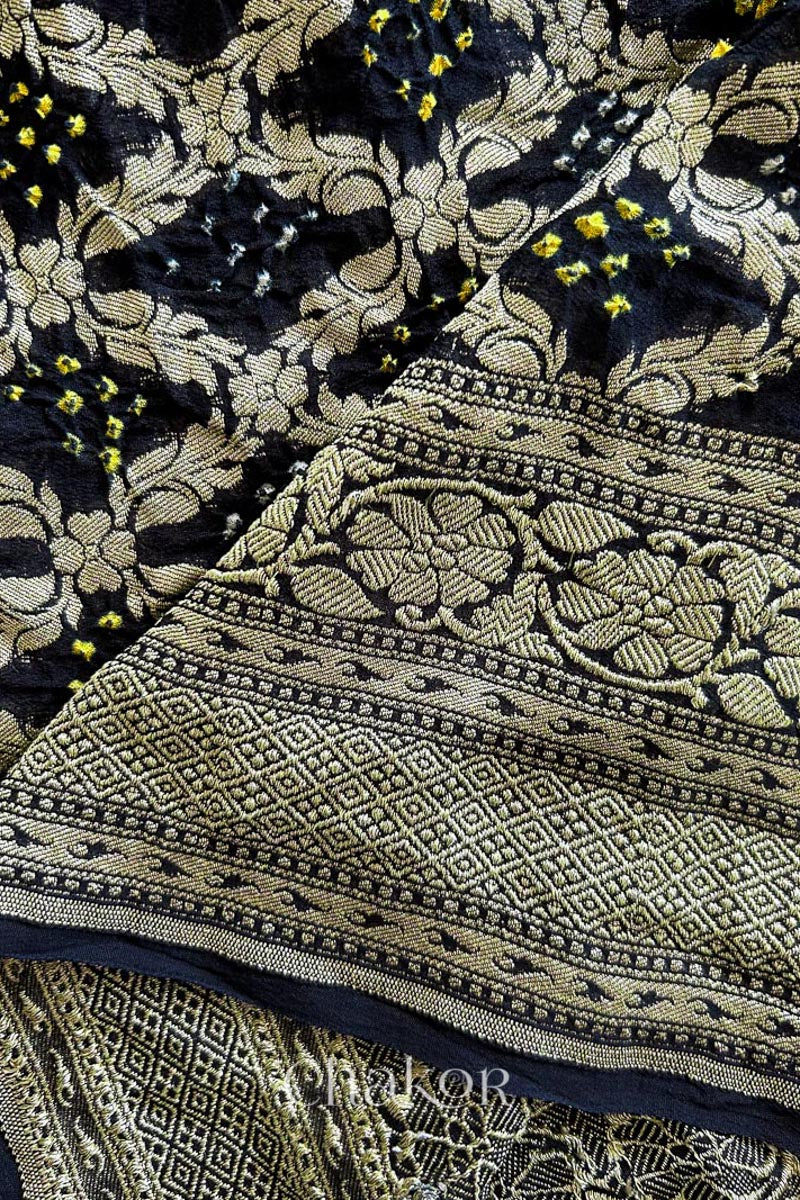 Close up of Handcrafted Black Bandhani Banarasi Georgette Saree in pure silk featuring zari weaving and Kutch Bandhej for weddings and occasions.