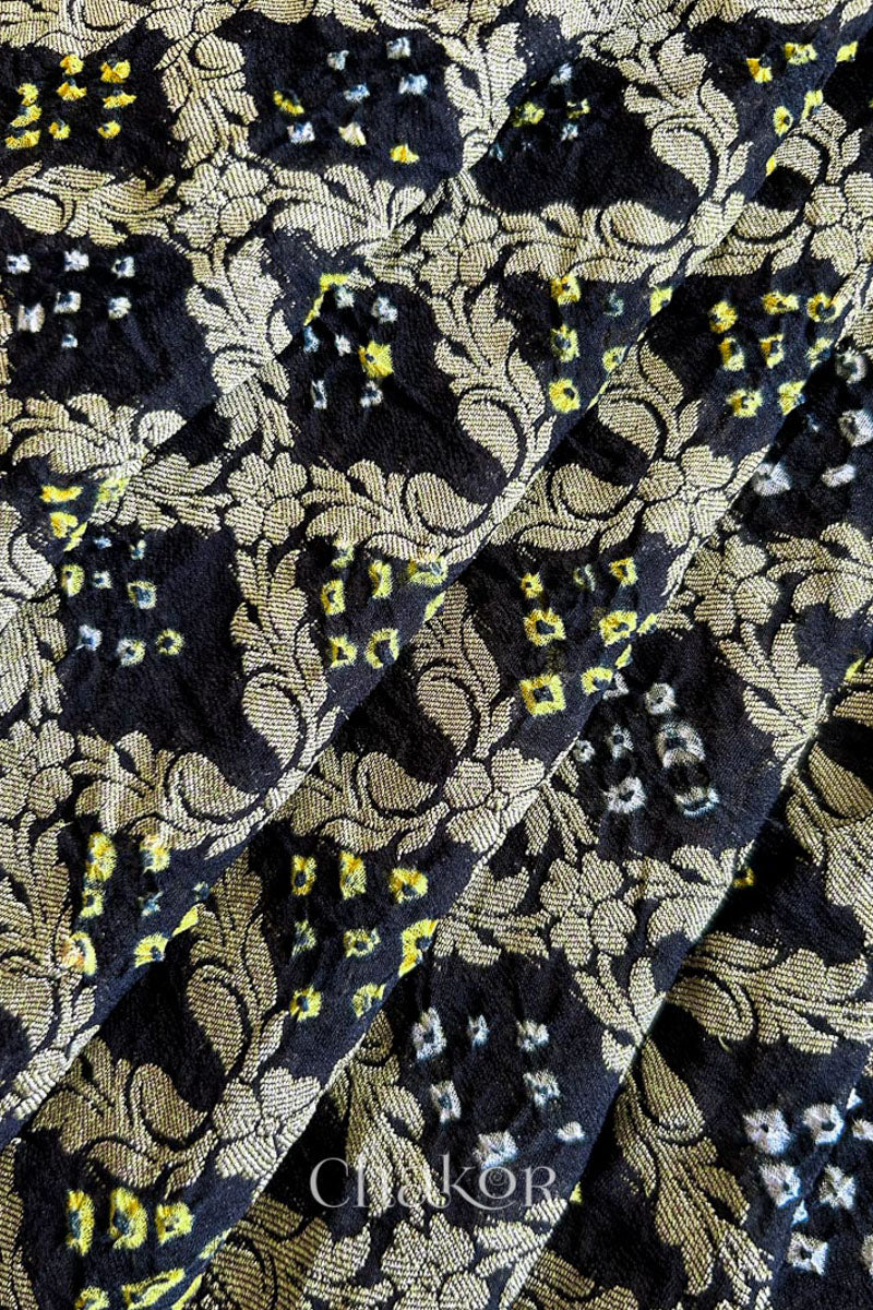 Close up of Handcrafted Black Bandhani Banarasi Georgette Saree in pure silk featuring zari weaving and Kutch Bandhej for weddings and occasions.