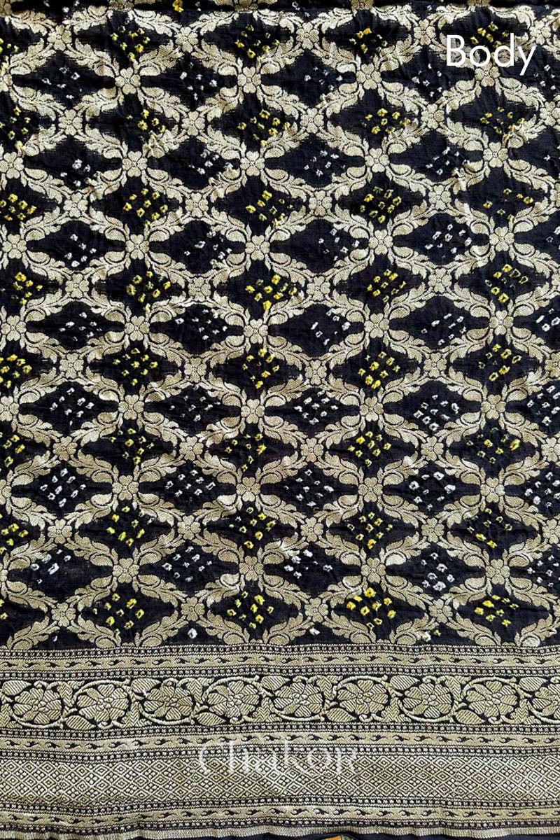 Close up of Handcrafted Black Bandhani Banarasi Georgette Saree in pure silk featuring zari weaving and Kutch Bandhej for weddings and occasions.