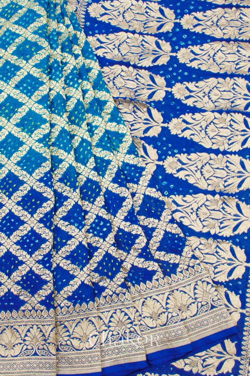 Close up of Handcrafted Peacock Blue  Bandhani Banarasi Georgette Silk Saree featuring zari weaving and Kutch rai bandhej.