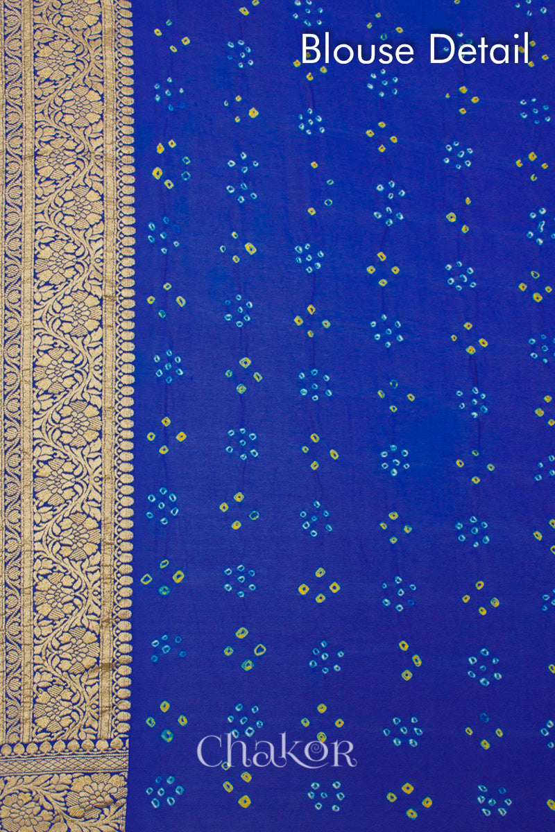 Close up of Handcrafted Peacock Blue  Bandhani Banarasi Georgette Silk Saree featuring zari weaving and Kutch rai bandhej.