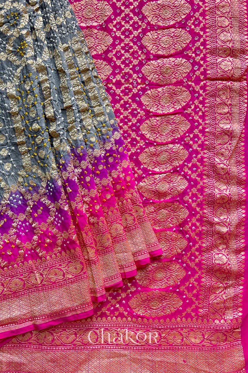 Close up of Handcrafted Pink and grey ombre shaded Bandhani Banarasi Georgette Silk Saree featuring zari weaving and Kutch Bandhej.