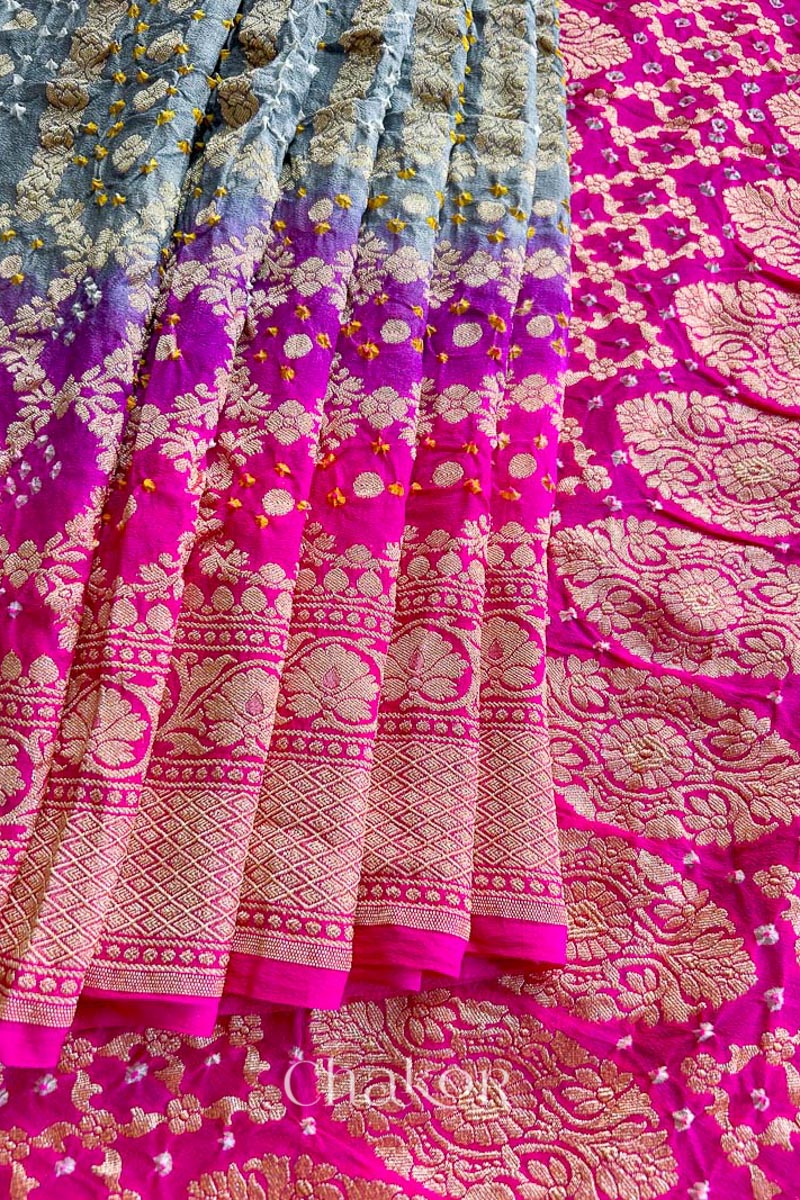 Close up of Handcrafted Pink and grey ombre shaded Bandhani Banarasi Georgette Silk Saree featuring zari weaving and Kutch Bandhej.