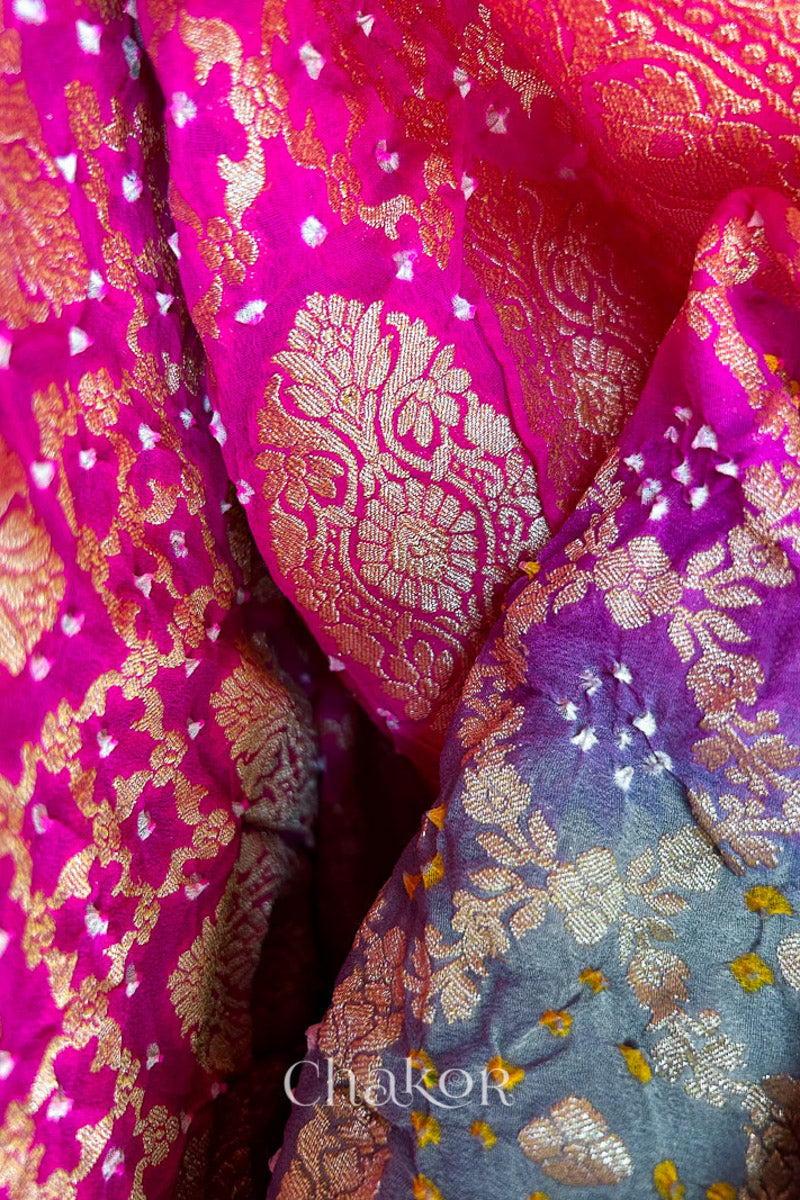 Close up of Handcrafted Pink and grey ombre shaded Bandhani Banarasi Georgette Silk Saree featuring zari weaving and Kutch Bandhej.