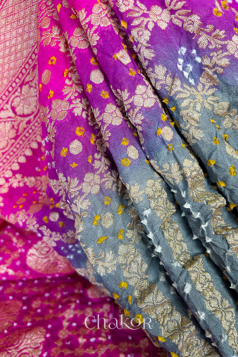 Close up of Handcrafted Pink and grey ombre shaded Bandhani Banarasi Georgette Silk Saree featuring zari weaving and Kutch Bandhej.