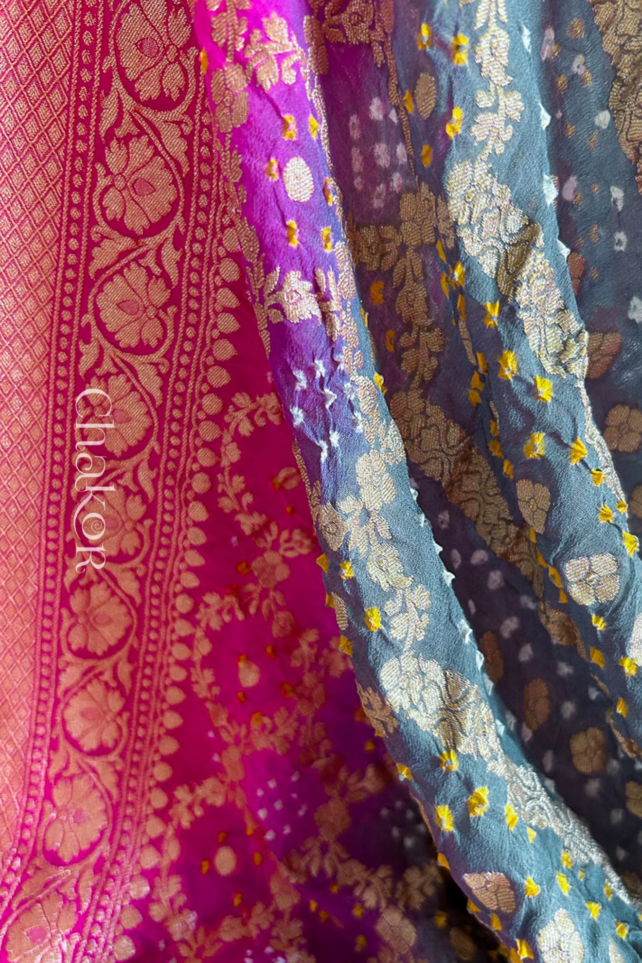 Close up of Handcrafted Pink and grey ombre shaded Bandhani Banarasi Georgette Silk Saree featuring zari weaving and Kutch Bandhej.