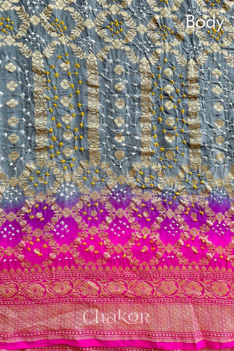 Close up of Handcrafted Pink and grey ombre shaded Bandhani Banarasi Georgette Silk Saree featuring zari weaving and Kutch Bandhej.