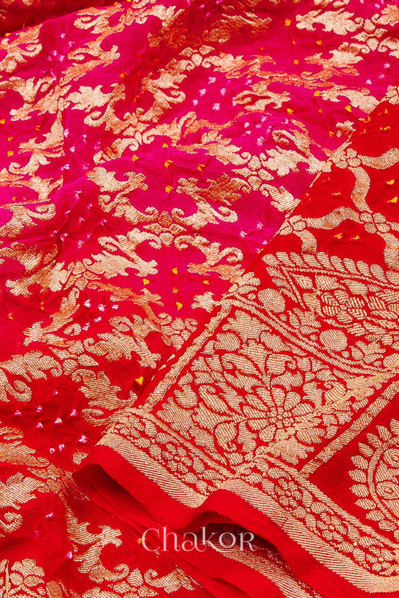 Close up of blouse of f Handcrafted Pink Red ombre shaded Bandhani Banarasi Georgette Saree in pure silk featuring zari weaving and Kutch Bandhej for weddings and occasions.