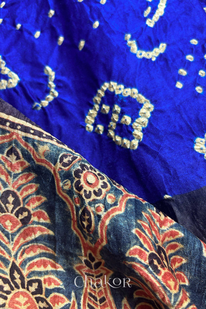 Close up of Blue Red Bandhani Ajrakh Silk Saree with intricate bandhani motifs and a zari stripe pallu, hand block printed using natural dyes on luxurious gaji silk fabric.