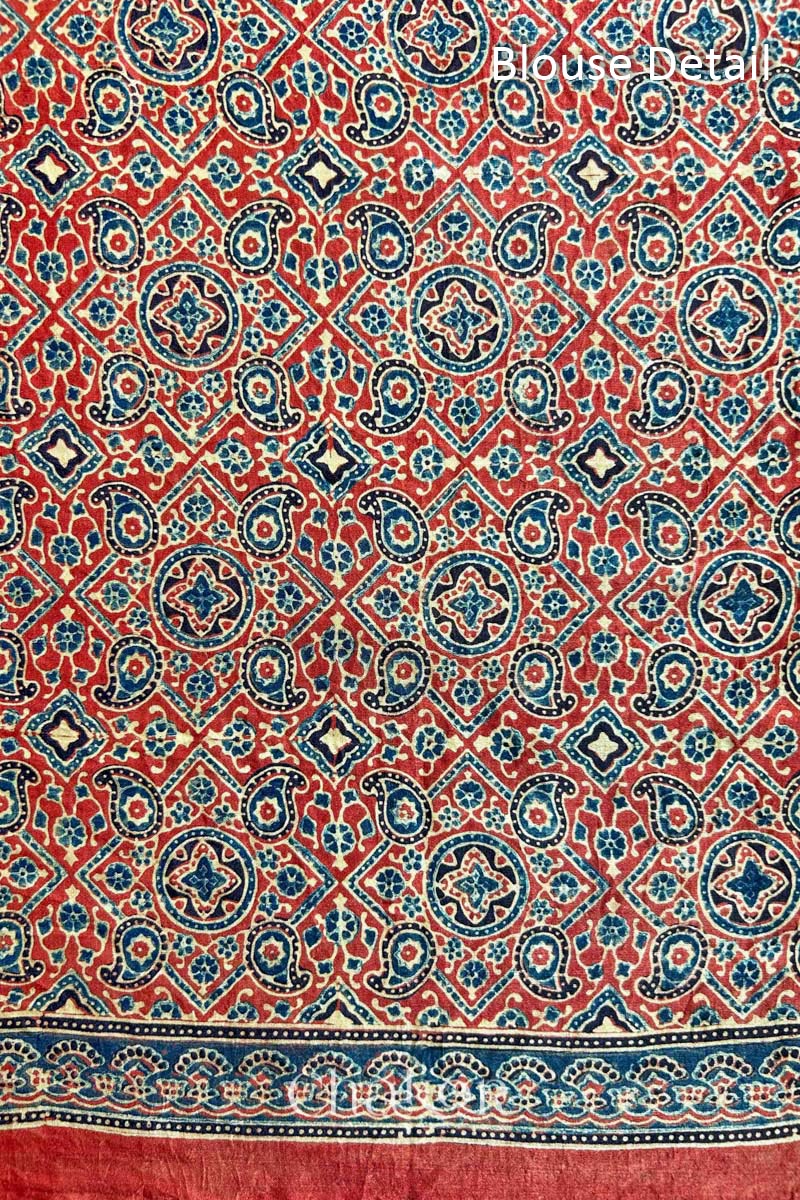 Blouse Material of Blue Red Bandhani Ajrakh Silk Saree with intricate bandhani motifs and a zari stripe pallu, hand block printed using natural dyes on luxurious gaji silk fabric.