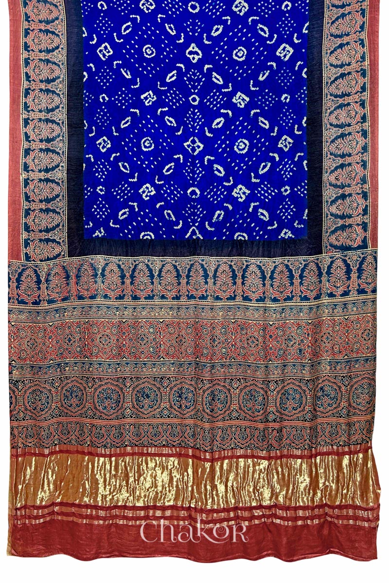 Full view Blue Bandhani Saree with Red Ajrakh printed border and pallu in pure gaji silk with traditional bandhej tie-dye, handcrafted in Kutch. 