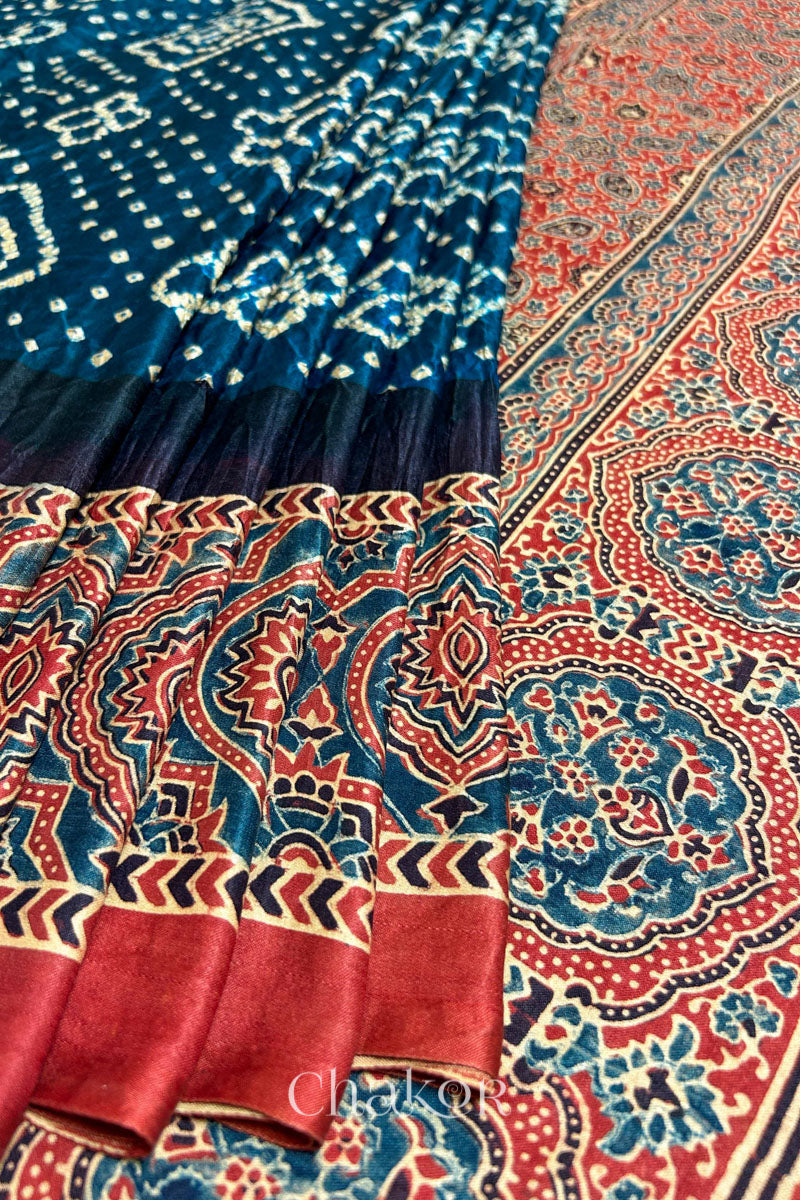 Close up of Navy Bandhani Saree with Red Ajrakh printed border and pallu in pure gaji silk with traditional bandhej tie-dye, handcrafted in Kutch. 