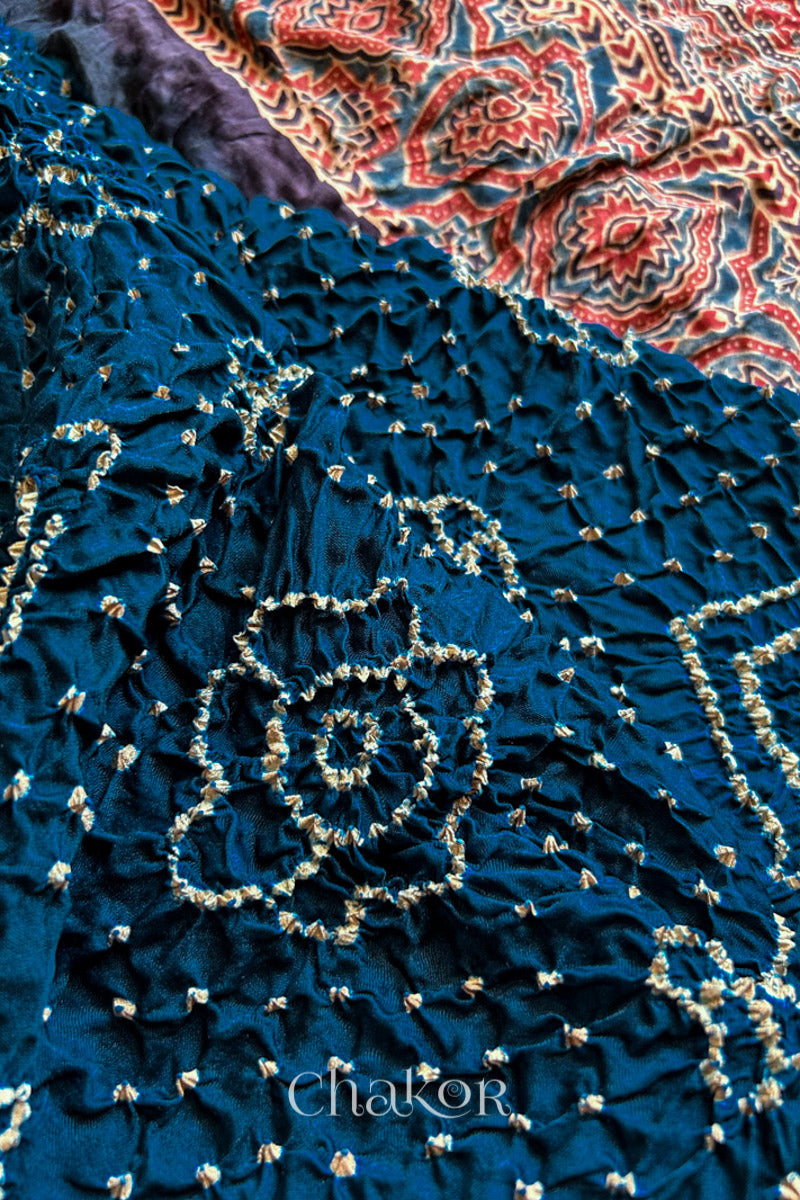 Close up of Navy Bandhani Saree with Red Ajrakh printed border and pallu in pure gaji silk with traditional bandhej tie-dye, handcrafted in Kutch. 