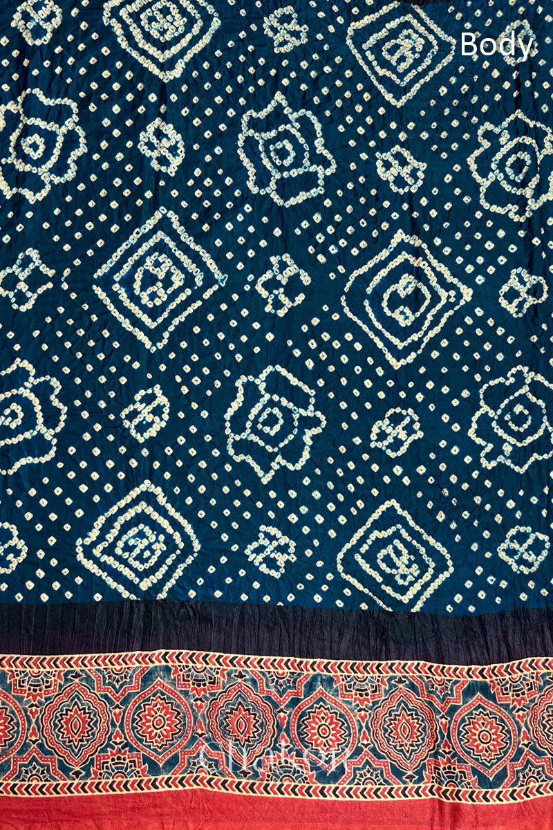 Close up of Navy Bandhani Saree with Red Ajrakh printed border and pallu in pure gaji silk with traditional bandhej tie-dye, handcrafted in Kutch. 