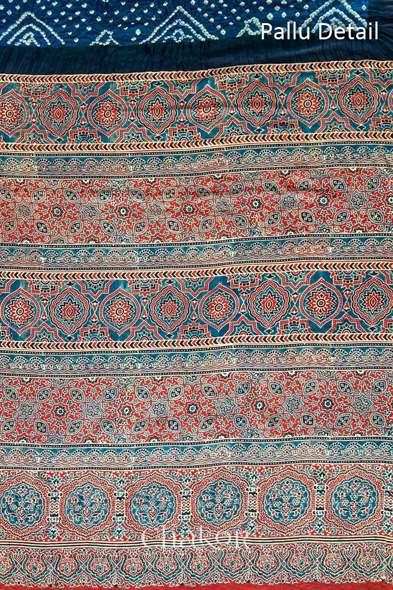 Close up of Navy Bandhani Saree with Red Ajrakh printed border and pallu in pure gaji silk with traditional bandhej tie-dye, handcrafted in Kutch. 