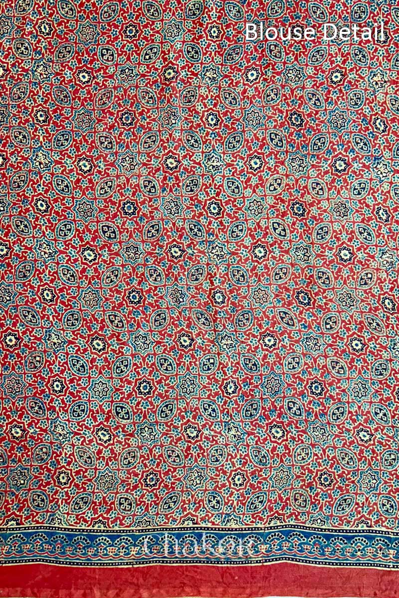 Close up of Navy Bandhani Saree with Red Ajrakh printed border and pallu in pure gaji silk with traditional bandhej tie-dye, handcrafted in Kutch. 
