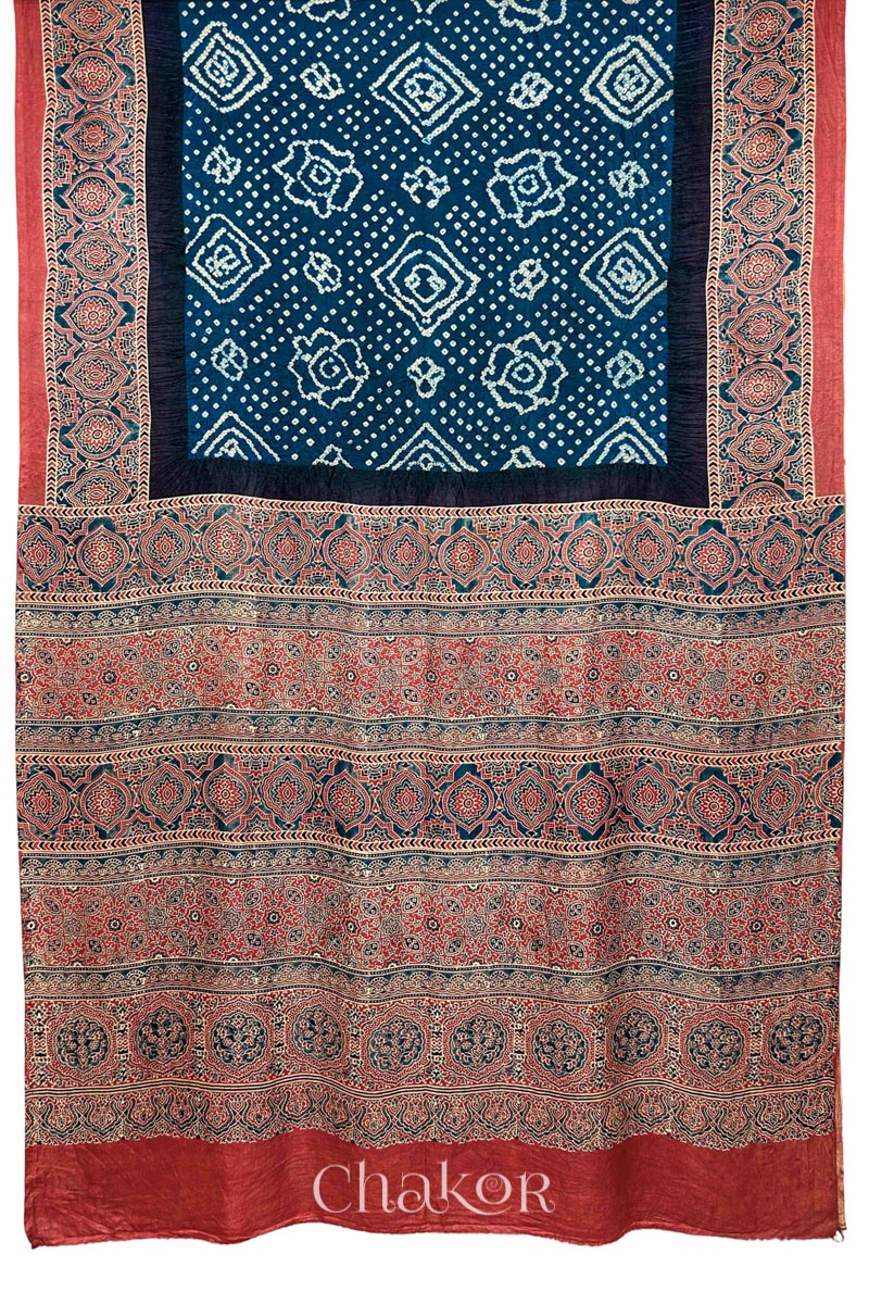Close up of Navy Bandhani Saree with Red Ajrakh printed border and pallu in pure gaji silk with traditional bandhej tie-dye, handcrafted in Kutch. 