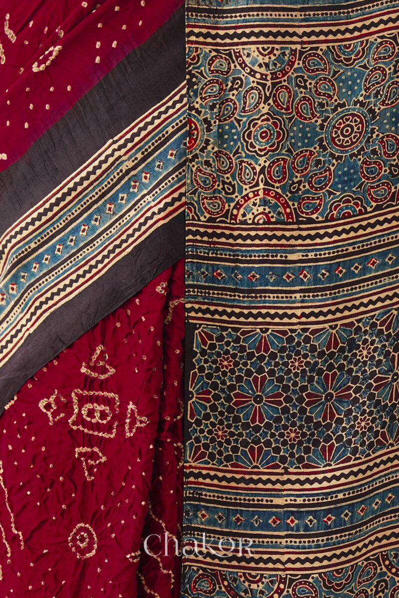 Close up of Maroon Bandhani Saree with Black Ajrakh printed border and pallu in pure gaji silk with traditional bandhej tie-dye, handcrafted in Kutch. 