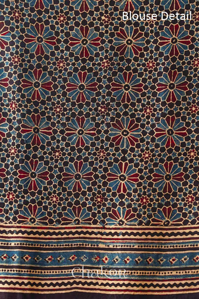 Blouse material detail of Maroon Bandhani Saree with Black Ajrakh printed border and pallu in pure gaji silk with traditional bandhej tie-dye, handcrafted in Kutch. 