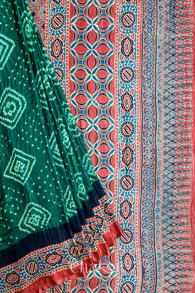 Close up of Green Bandhani Saree with Ajrakh printed border and pallu in pure gaji silk with traditional bandhej tie-dye, handcrafted in Kutch. 