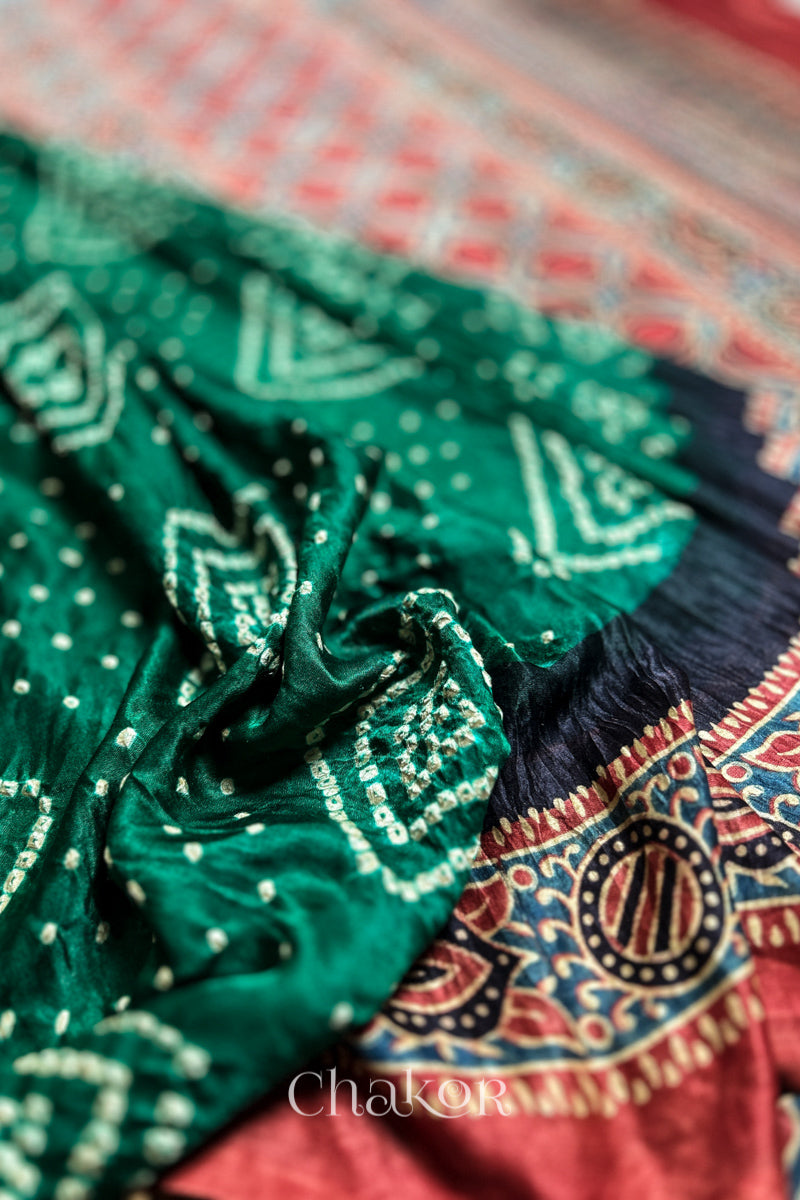 Close up of Green Bandhani Saree with Ajrakh printed border and pallu in pure gaji silk with traditional bandhej tie-dye, handcrafted in Kutch. 