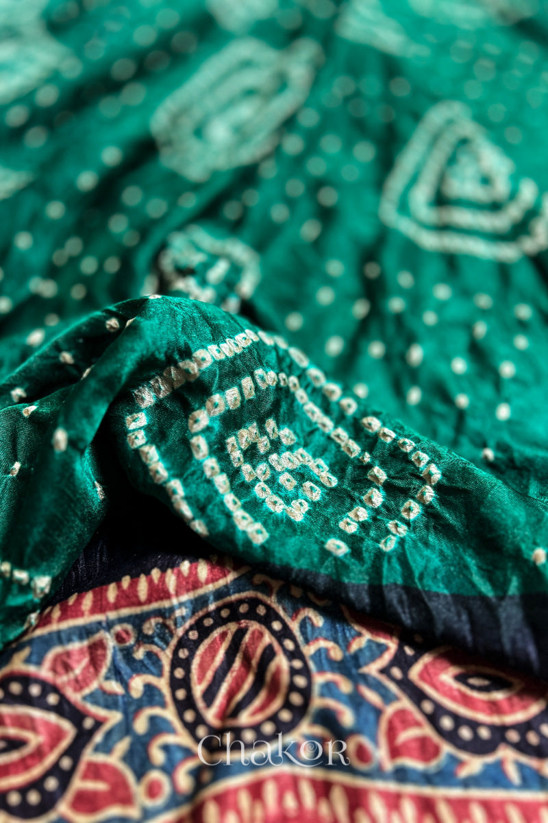 Close up of Green Bandhani Saree with Ajrakh printed border and pallu in pure gaji silk with traditional bandhej tie-dye, handcrafted in Kutch. 