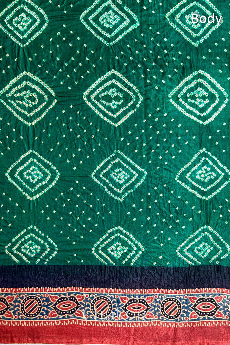 Close up of Green Bandhani Saree with Ajrakh printed border and pallu in pure gaji silk with traditional bandhej tie-dye, handcrafted in Kutch. 