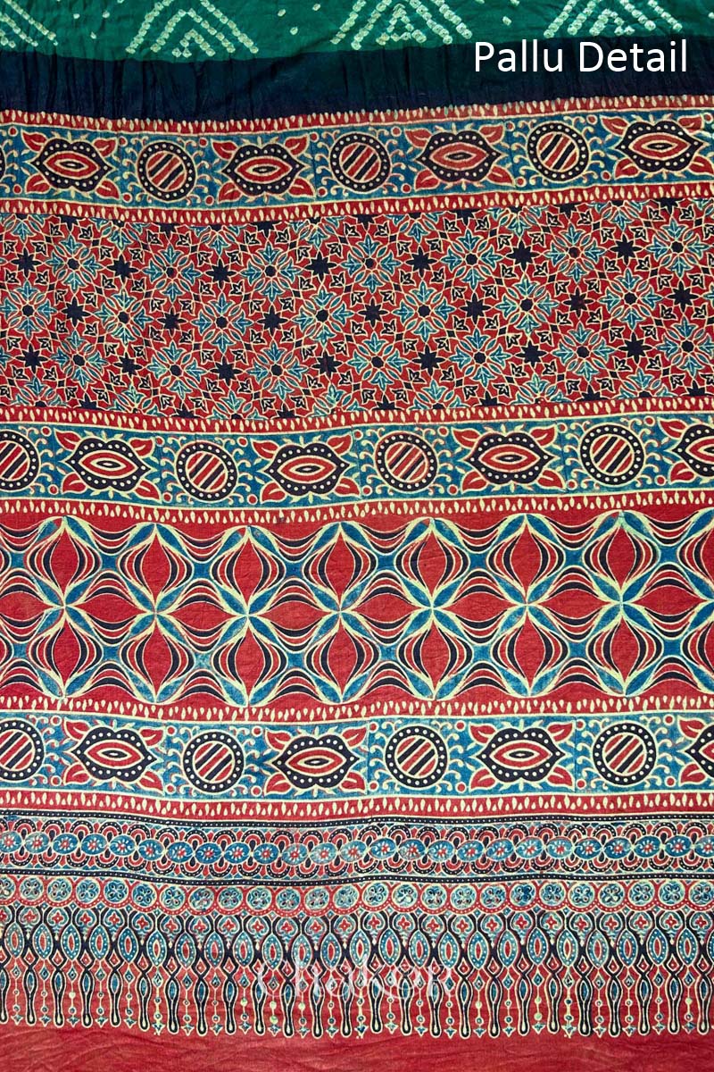 Close up of Green Bandhani Saree with Ajrakh printed border and pallu in pure gaji silk with traditional bandhej tie-dye, handcrafted in Kutch. 