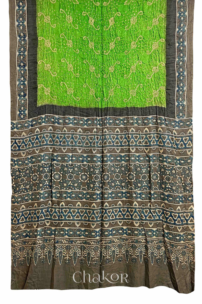 Full view of Parrot green Bandhani Saree with Brown Ajrakh printed border and pallu in pure gaji silk with traditional bandhej tie-dye, handcrafted in Kutch. 