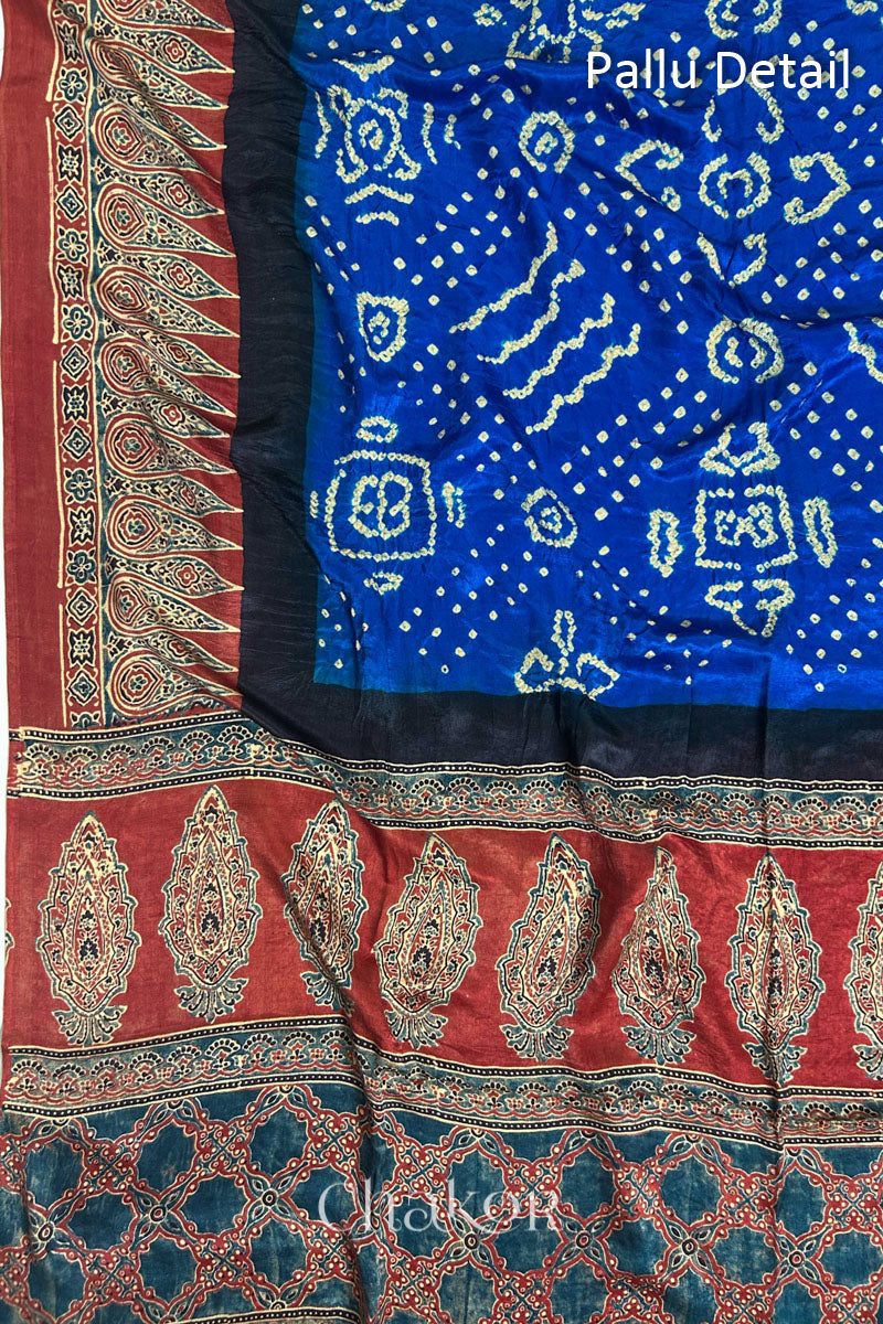 Close up of Blue Bandhani Saree with Natural Red Ajrakh printed border and pallu in pure gaji silk with traditional bandhej tie-dye, handcrafted in Kutch. 
